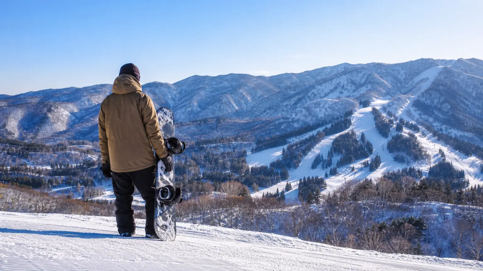 A person with a snowboard on a sunny slope (photo goal)