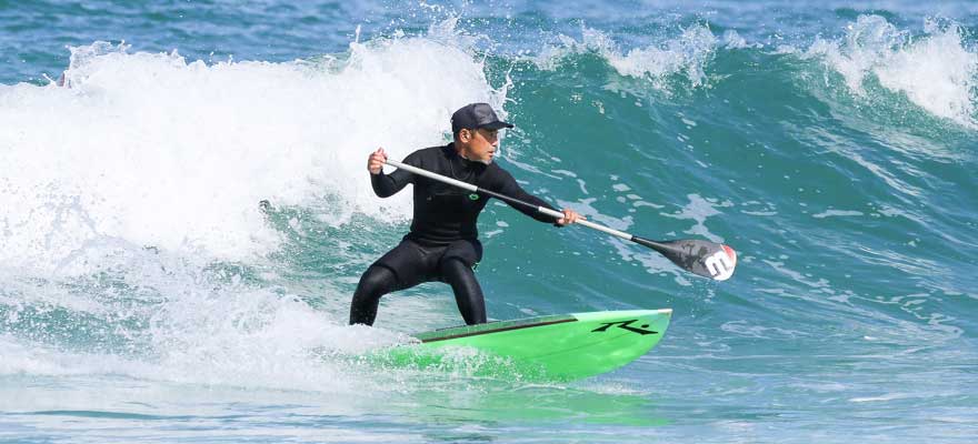 SUP surfing on a wave